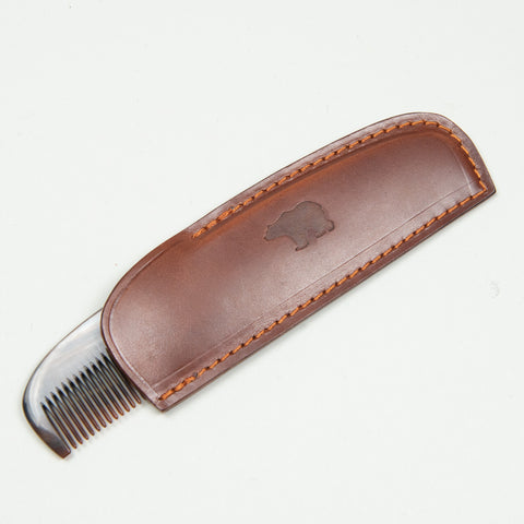 Horn comb with brown case