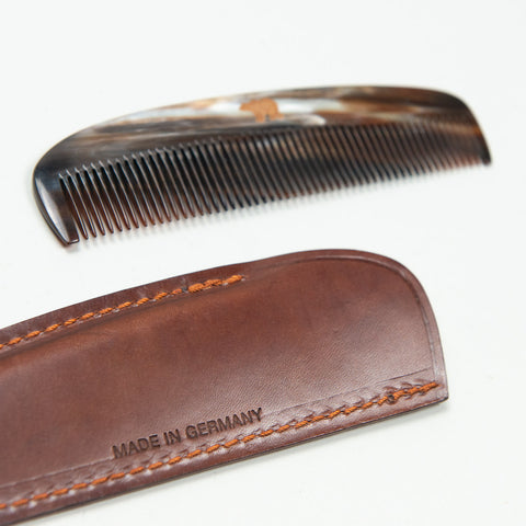 Horn comb with brown case