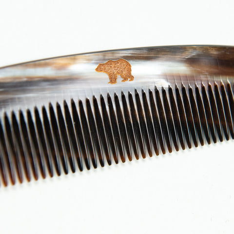 Horn comb with brown case